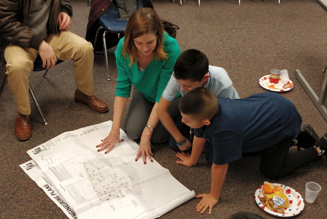 Teacher helping students